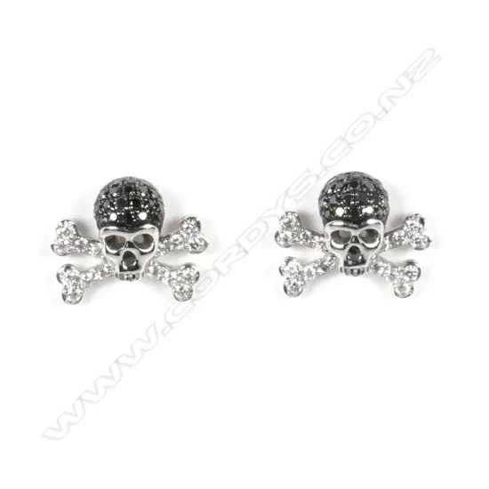 A pair of 18ct white gold and diamond skull and cross-bone earrings