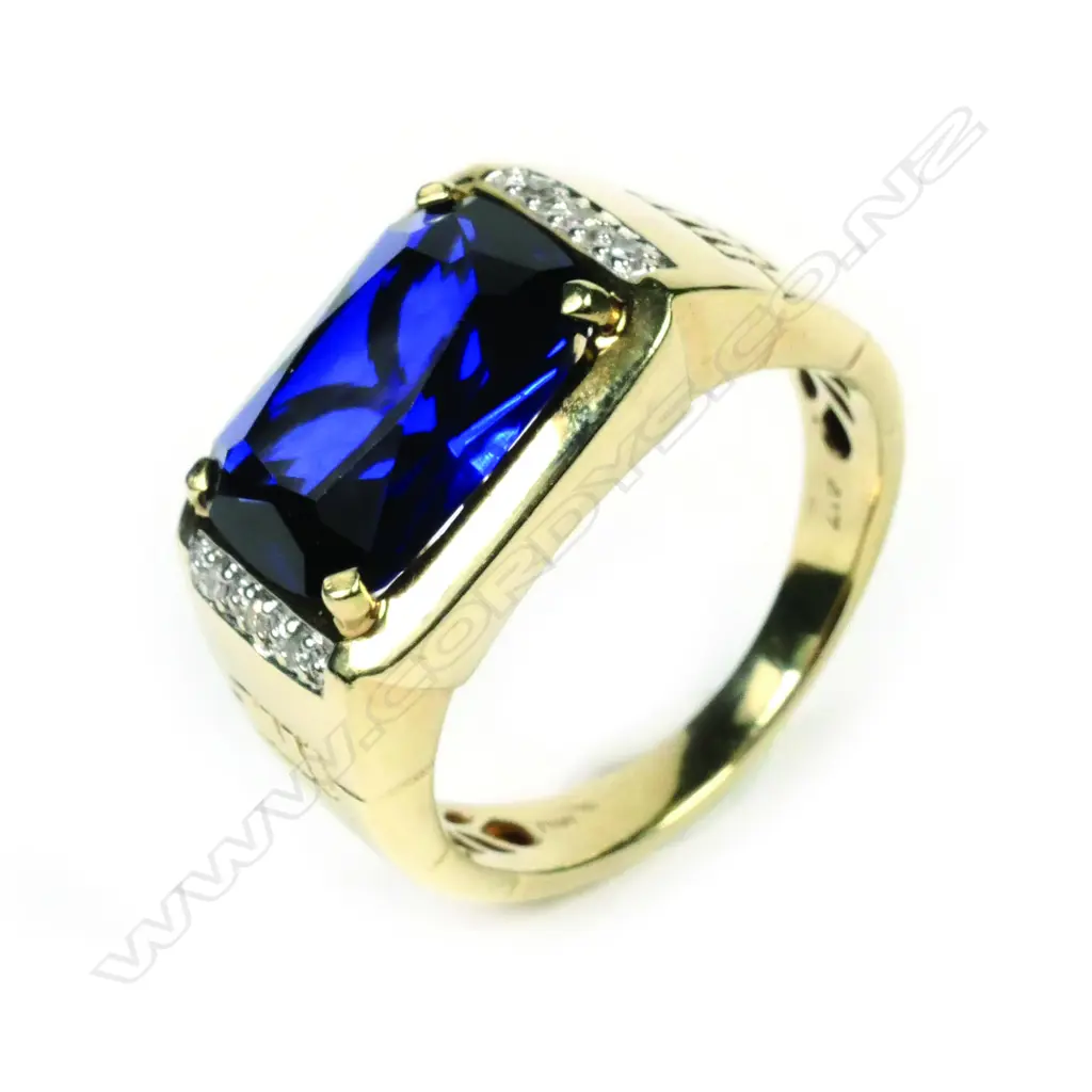 A gent’s blue stone and diamond ring Image 1++