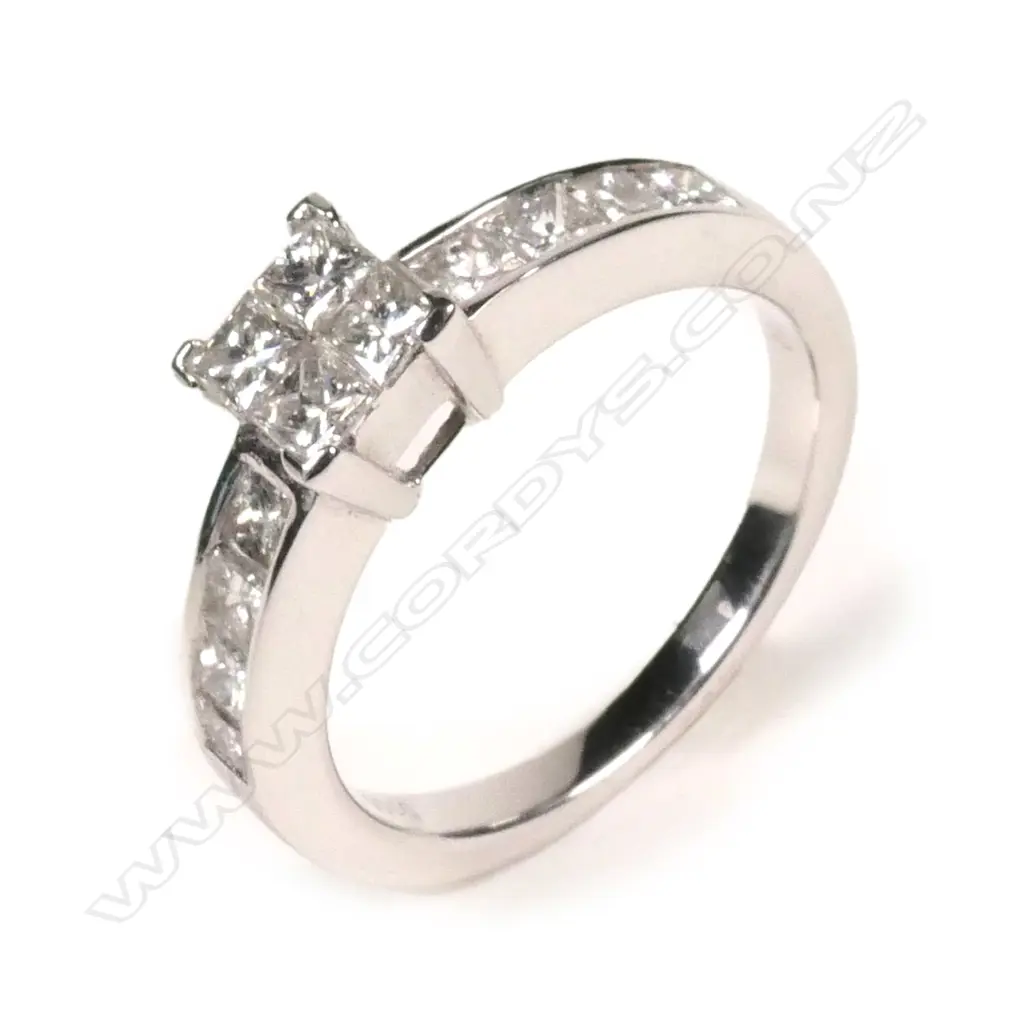 An 18ct white gold and diamond cluster ring Image 1++
