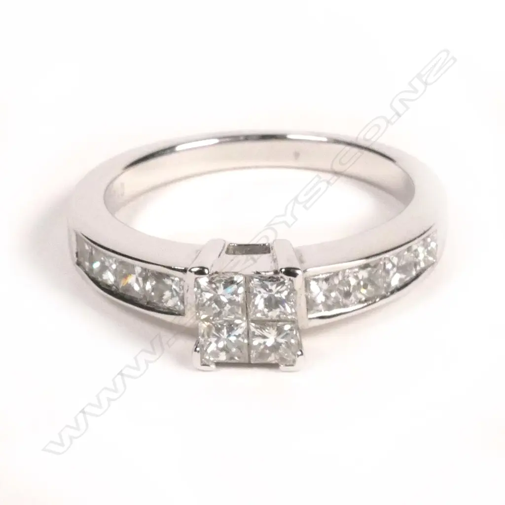 An 18ct white gold and diamond cluster ring Image 1++