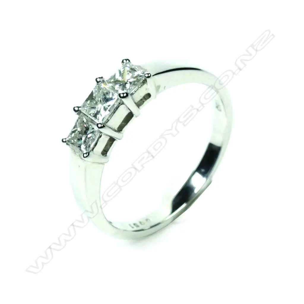 A modern 18ct white gold three stone diamond ring Image 1++