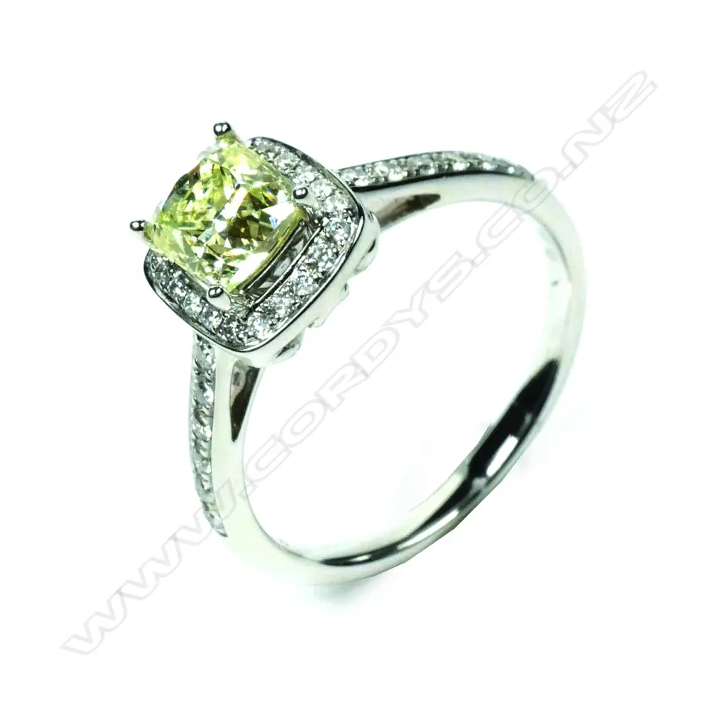 An 18ct white gold solitaire yellow diamond ring Image 1++