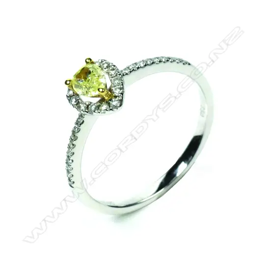 An 18ct white gold yellow and white diamond ring