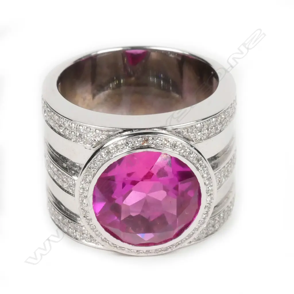 A large 18ct white gold pink stone and diamond ring Image 1++