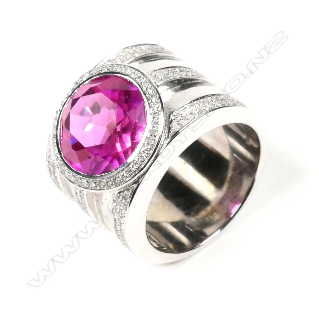 A large 18ct white gold pink stone and diamond ring Image 1++