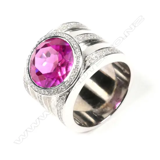 A large 18ct white gold pink stone and diamond ring