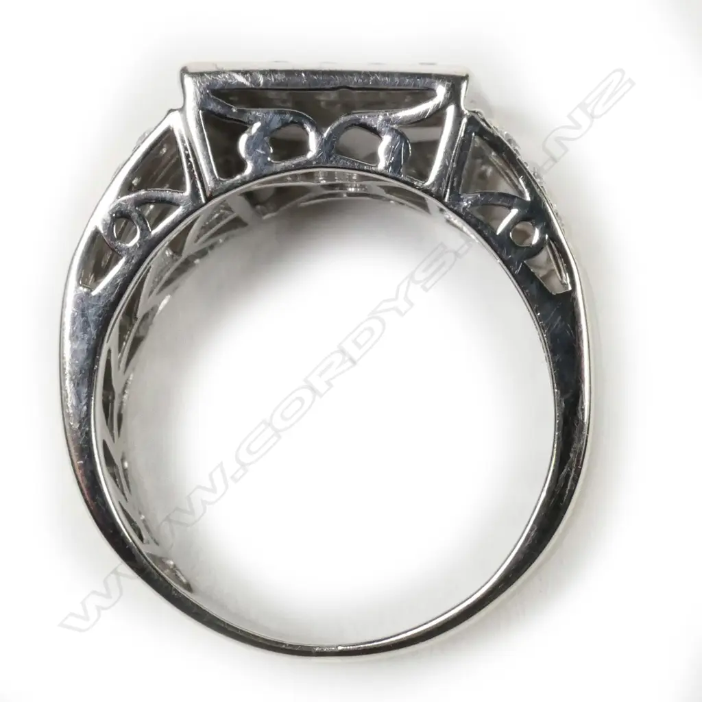 A large 10ct gold and multi diamond signet type ring Image 1++