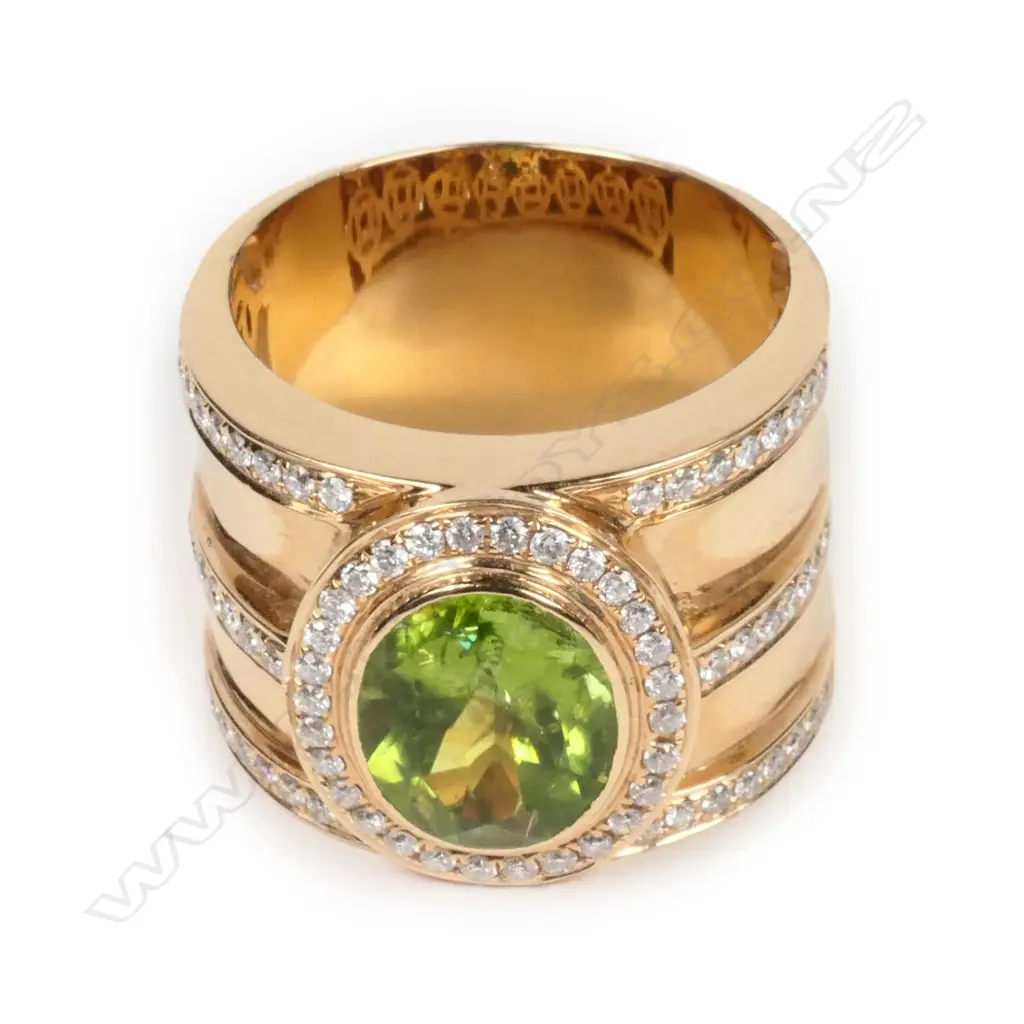 A large 18ct rose gold peridot and diamond ring Image 1++