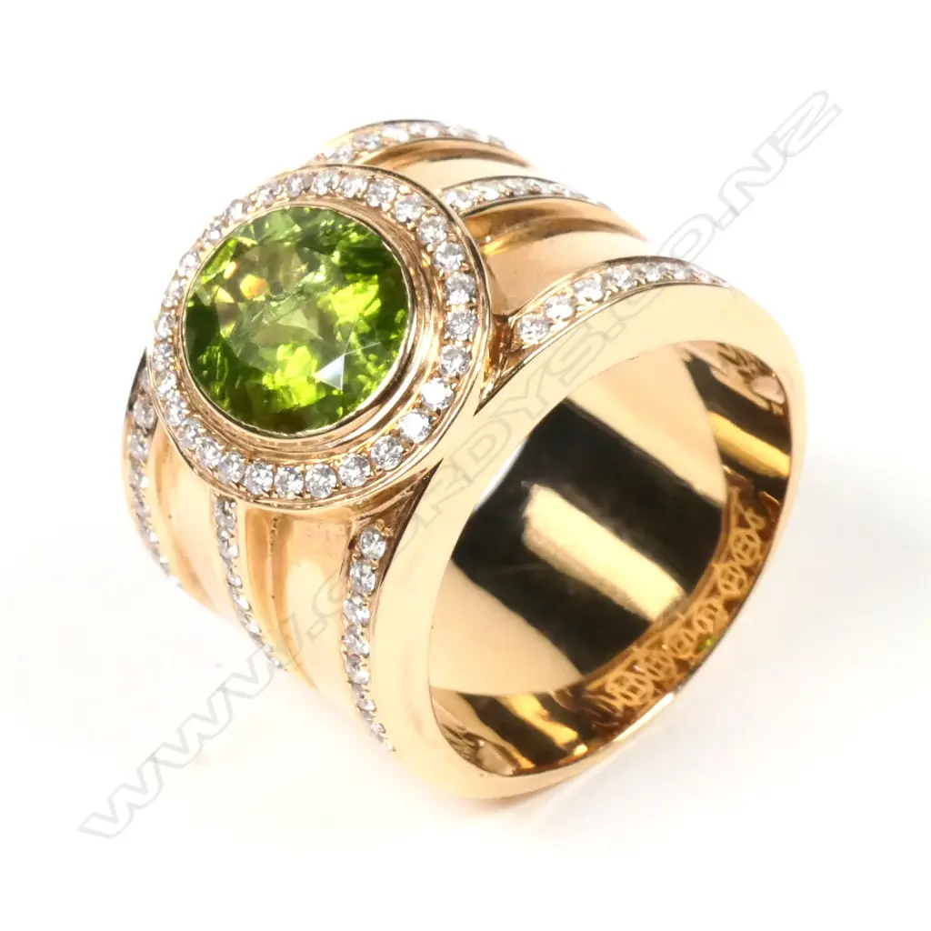 A large 18ct rose gold peridot and diamond ring Image 1++