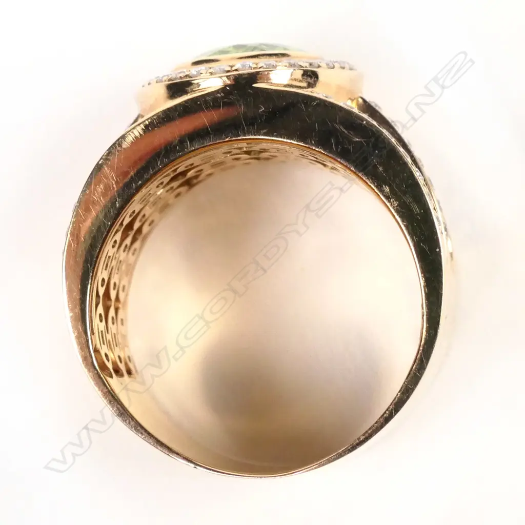 A large 18ct rose gold peridot and diamond ring Image 1++