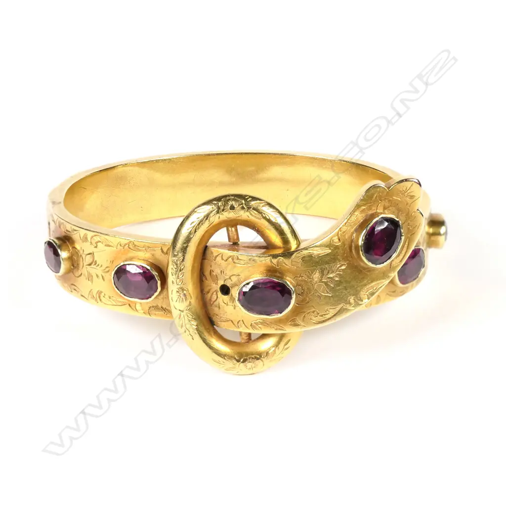 A Victorian gold and garnet hinged bangle Image 1++
