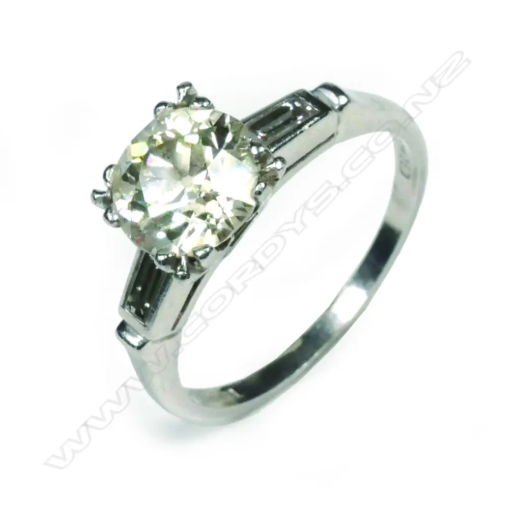 A platinum and diamond solitaire ring Image 1++