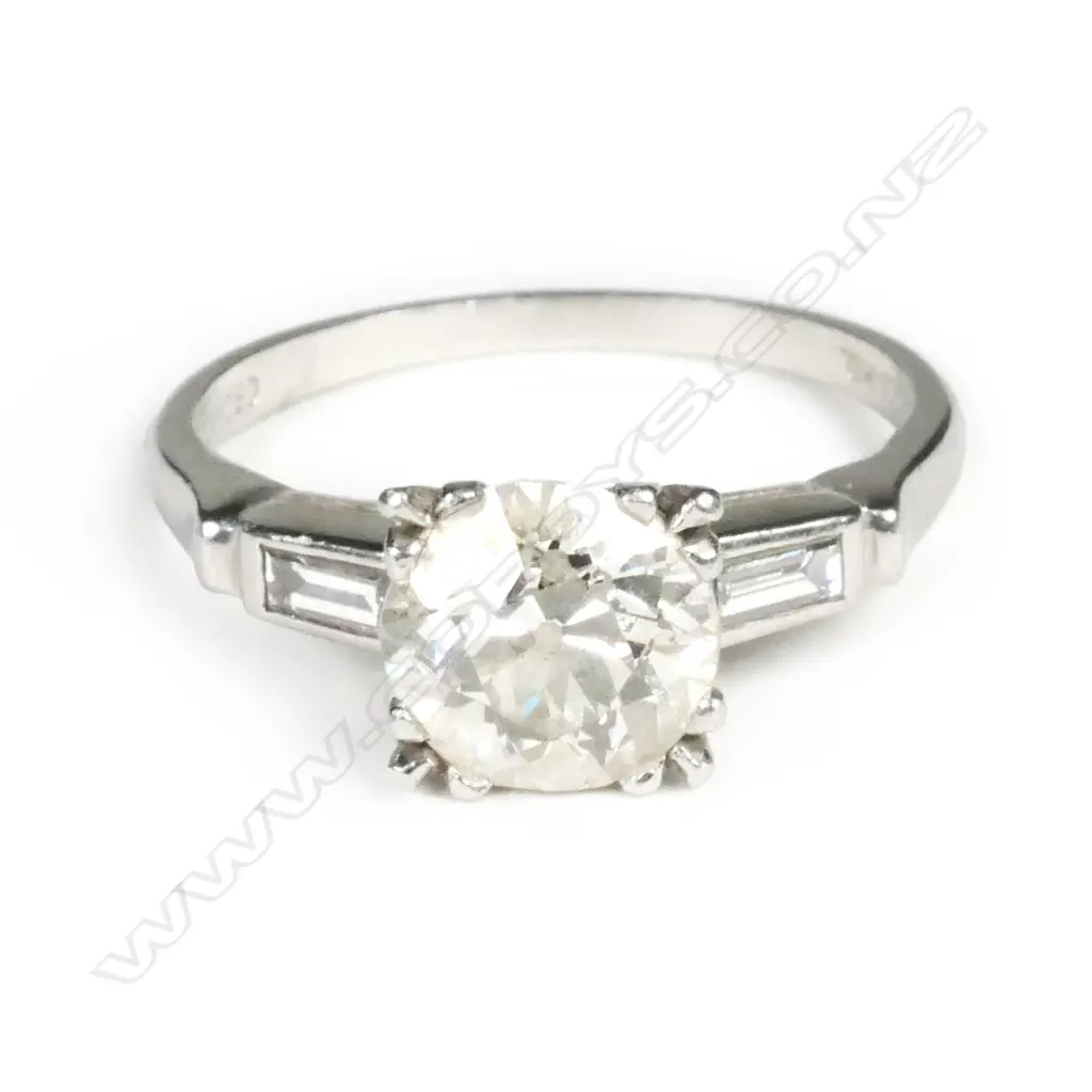 A platinum and diamond solitaire ring Image 1++
