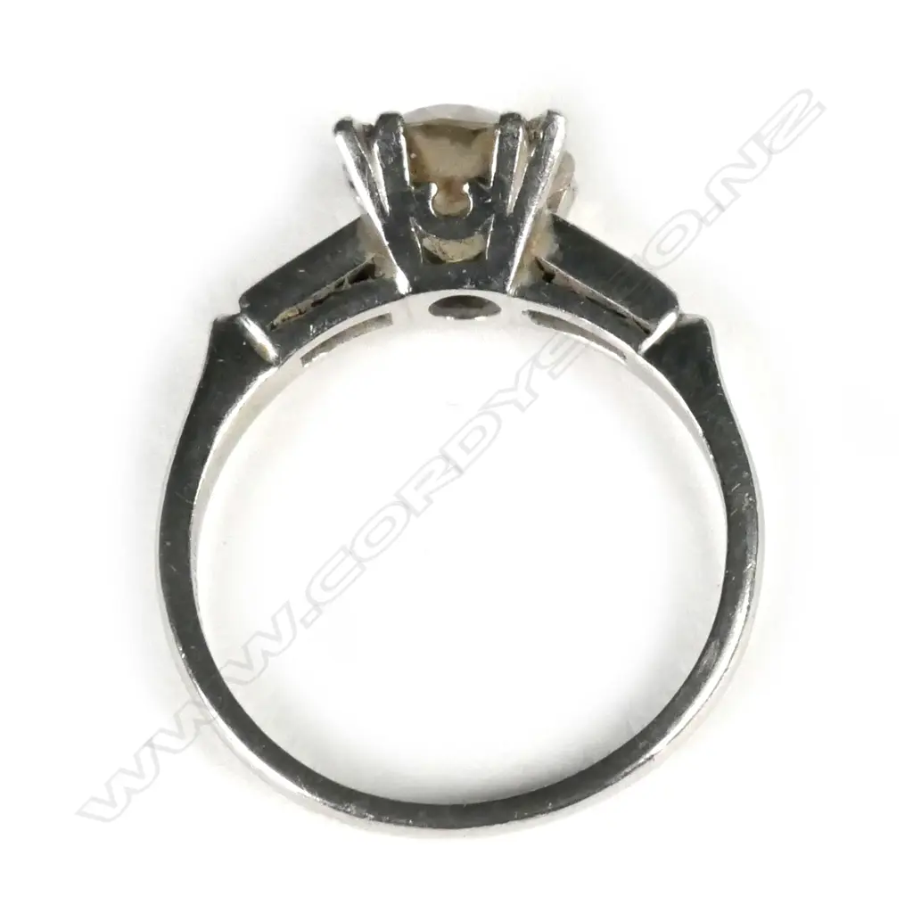 A platinum and diamond solitaire ring Image 1++