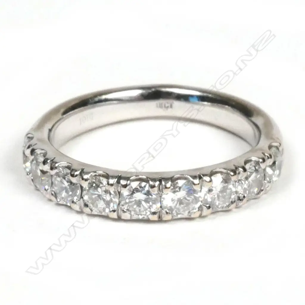 An 18ct white gold and diamond set band Image 1++
