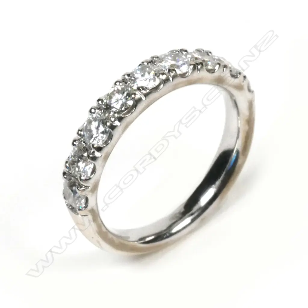 An 18ct white gold and diamond set band Image 1++
