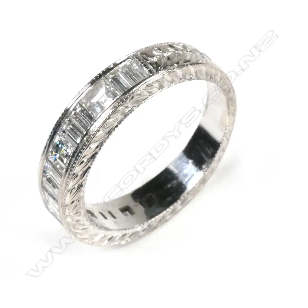 An 18ct white gold and diamond eternity band Image 1++