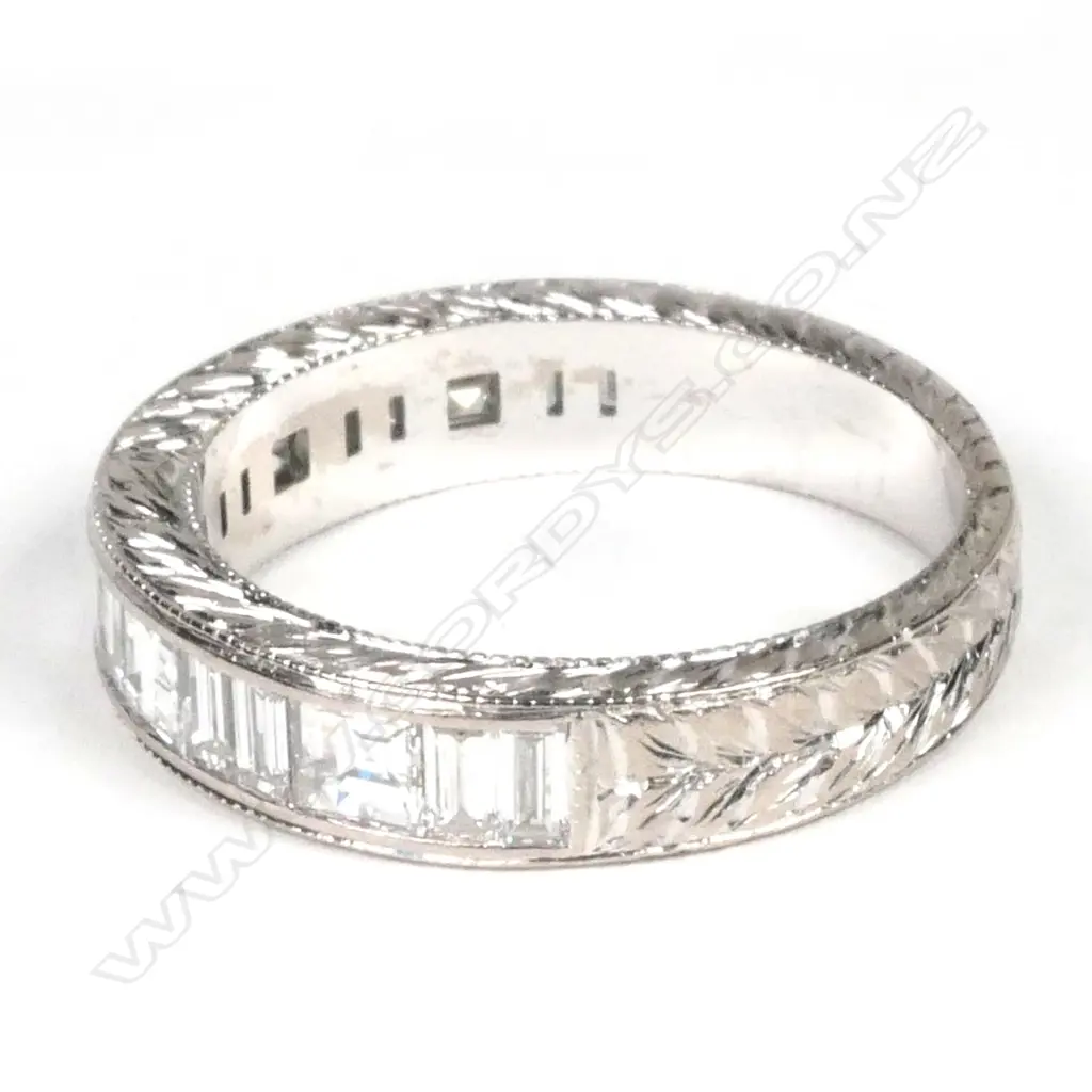 An 18ct white gold and diamond eternity band Image 1++
