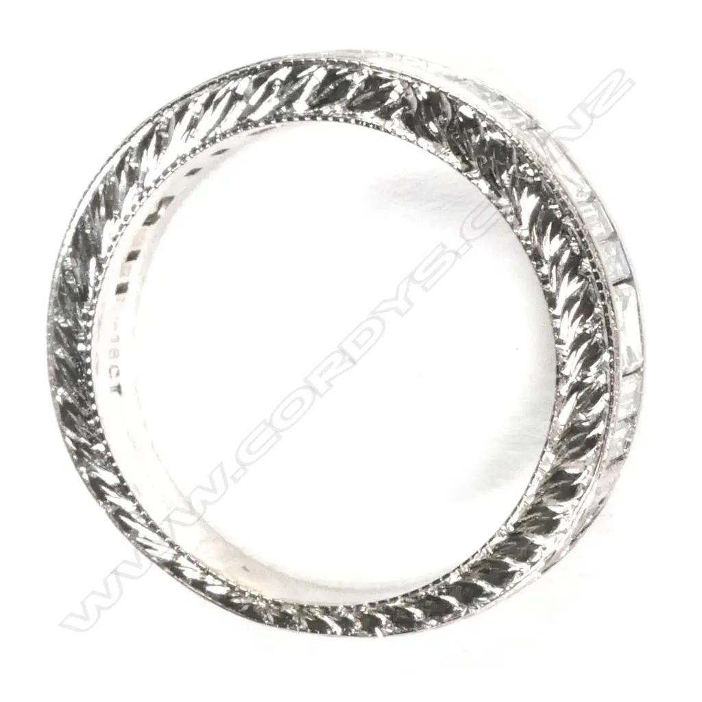An 18ct white gold and diamond eternity band Image 1++