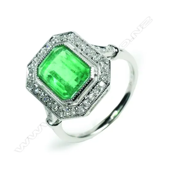 A 14ct white gold Columbian emerald and diamond Art Deco style ring