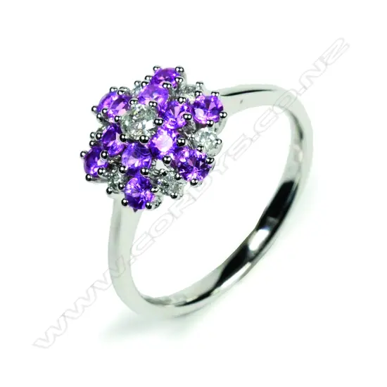 A 14ct white gold sapphire and diamond floral design ring