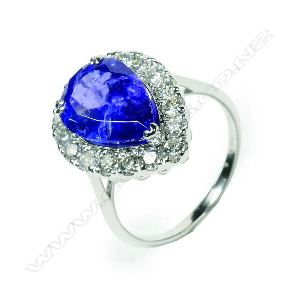 A 14ct white gold tanzanite and diamond halo ring Image 1++