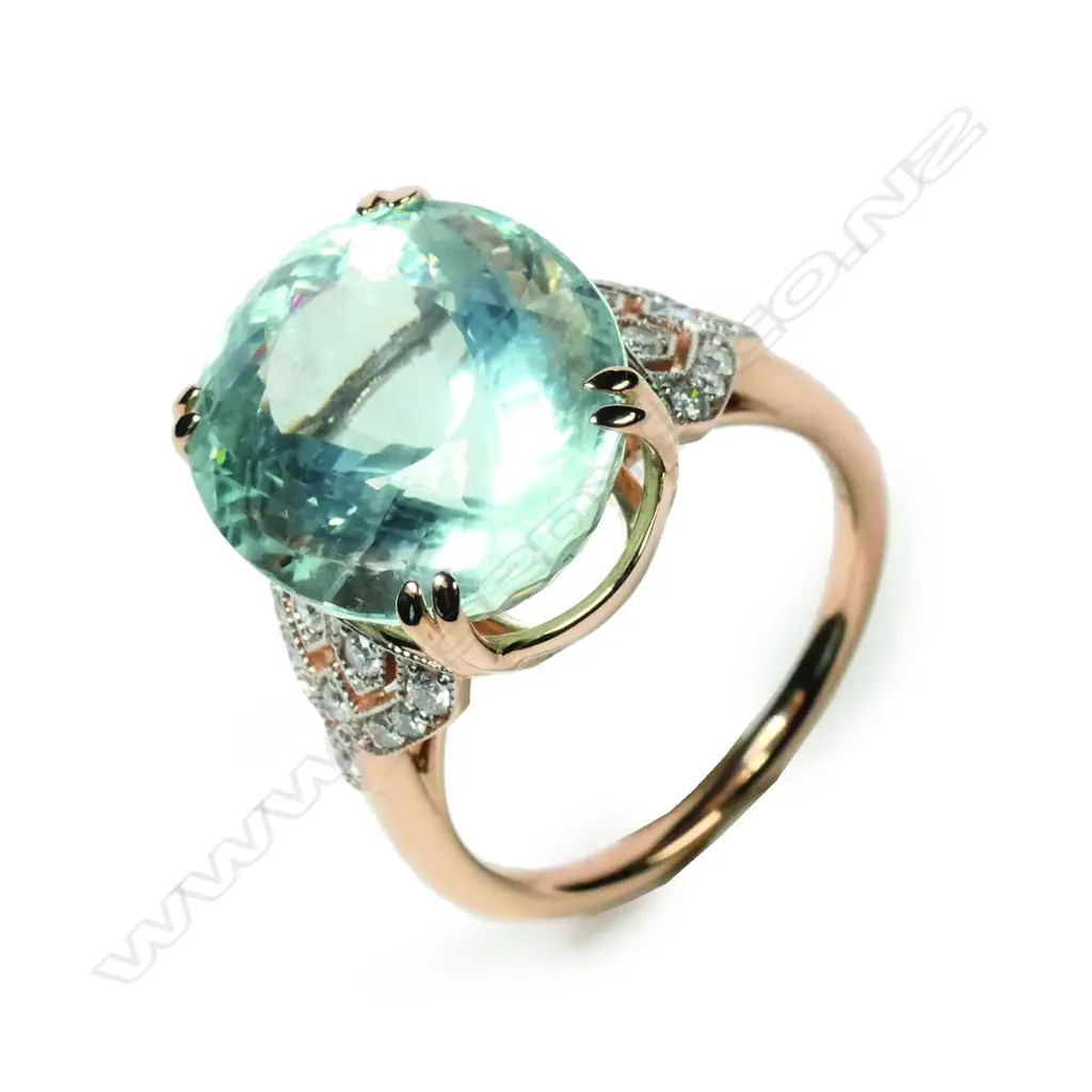 A 14ct rose gold aquamarine and diamond ring Image 1++