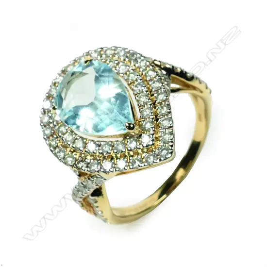 A 14ct gold aquamarine and diamond double halo ring