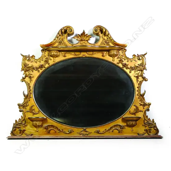 An ornate vintage French style overmantel mirror