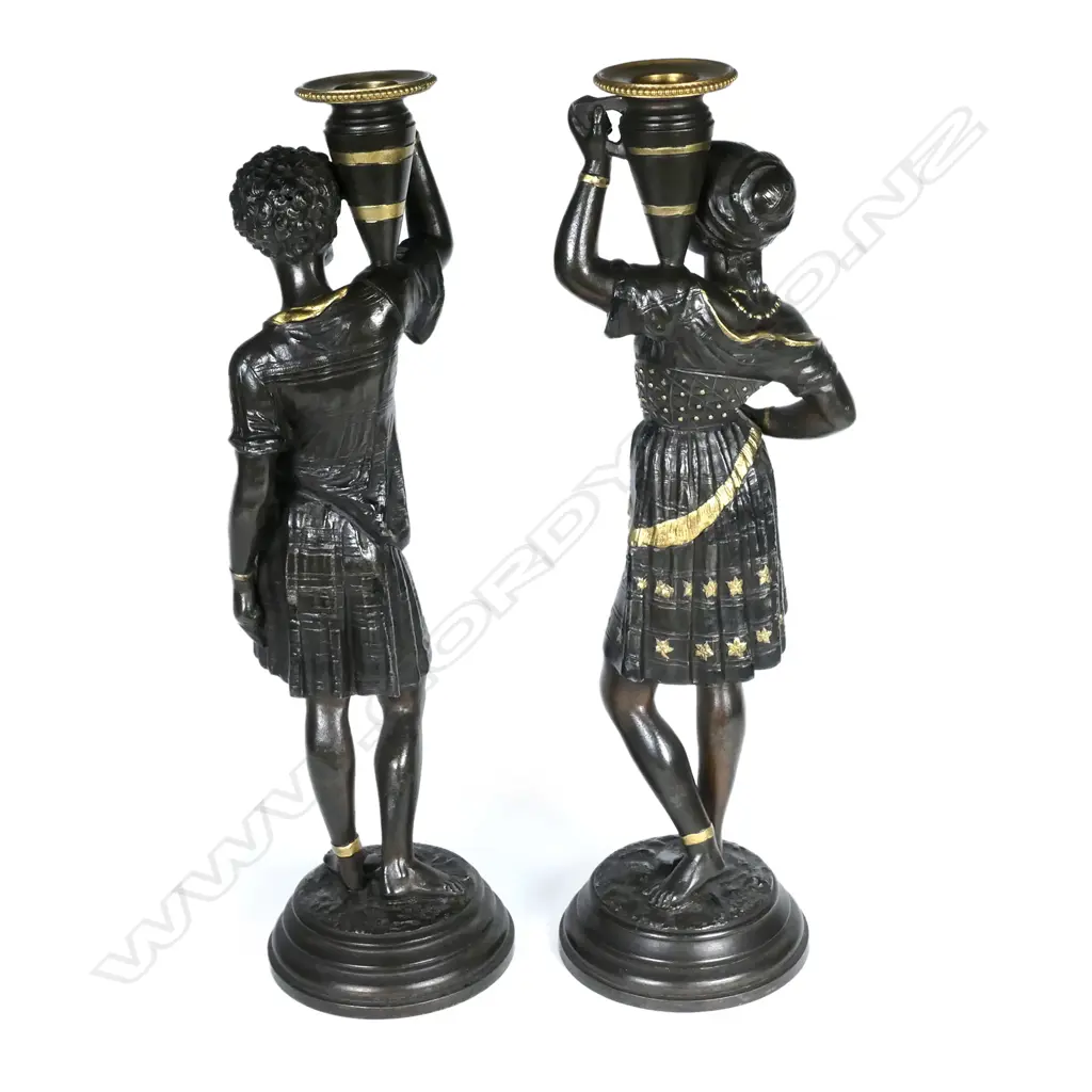 A pair of spelter figured candlesticks Image 1++