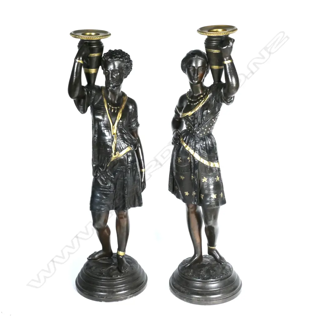 A pair of spelter figured candlesticks Image 1++