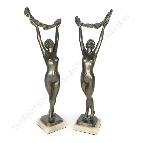 A pair of bronzed Art Deco figures