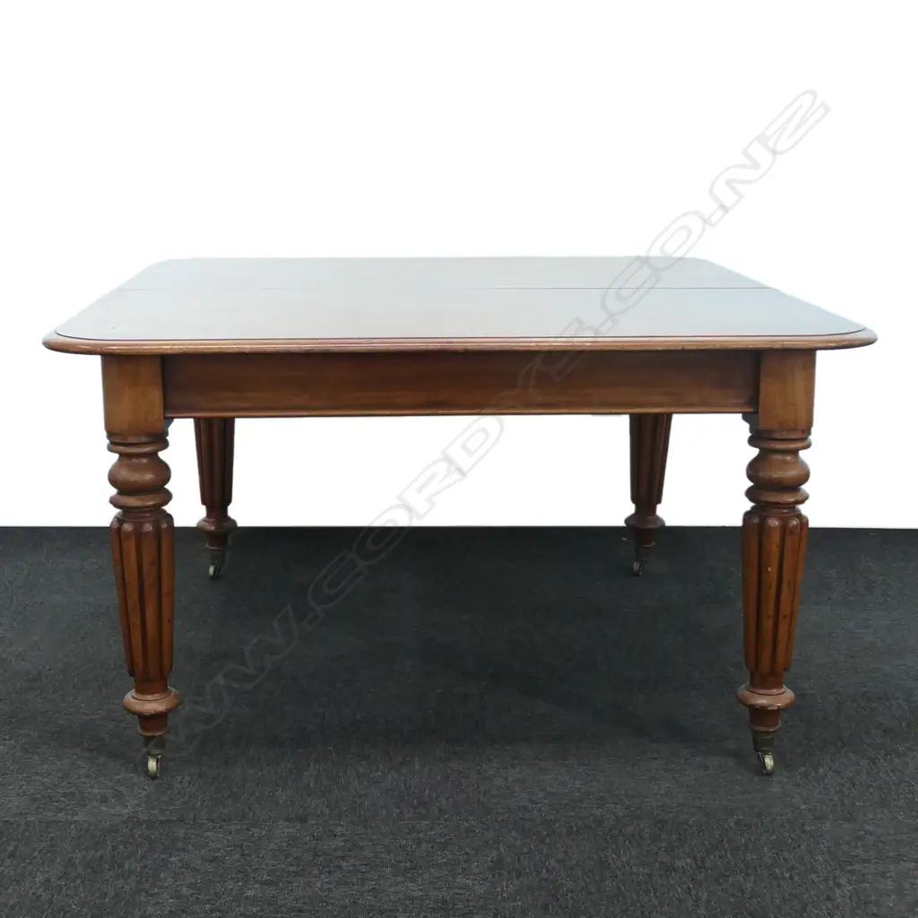 A Victorian mahogany two leaf extension dining table Image 1++