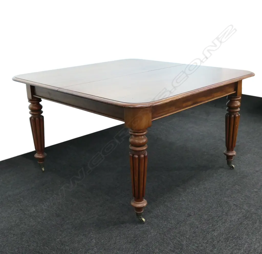 A Victorian mahogany two leaf extension dining table Image 1++