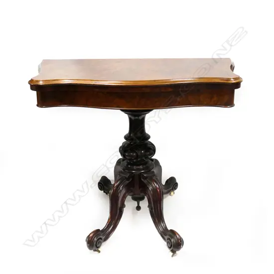 A Victorian walnut card table