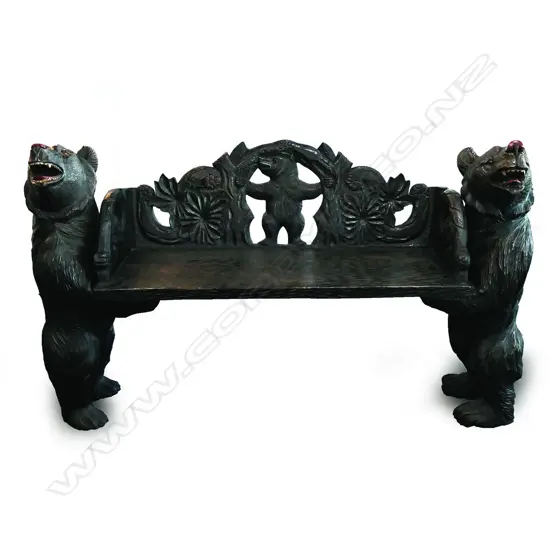 A vintage Black Forest style carved bear bench