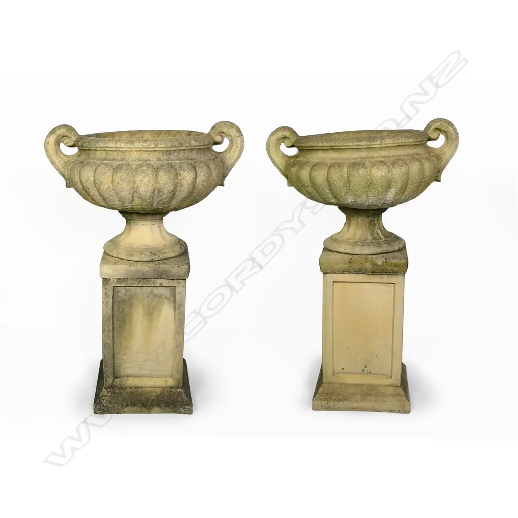 A pair of Church Stone classical garden urns on stands Image 1++