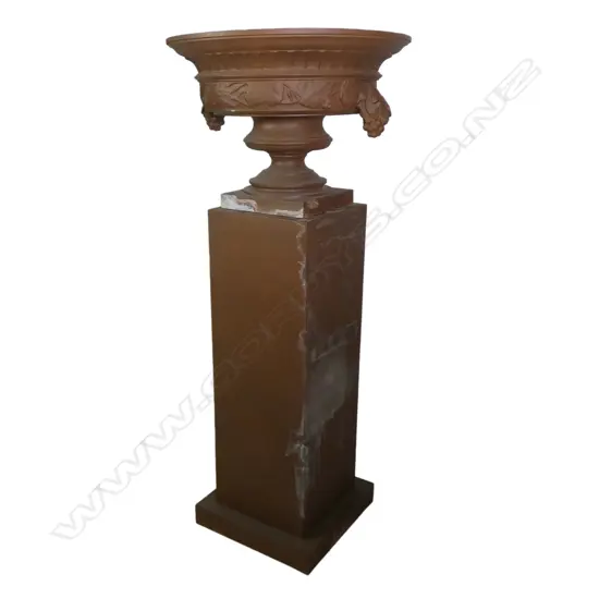 A large modern 'Val d'Osne grapes' classical urn on tall plinth