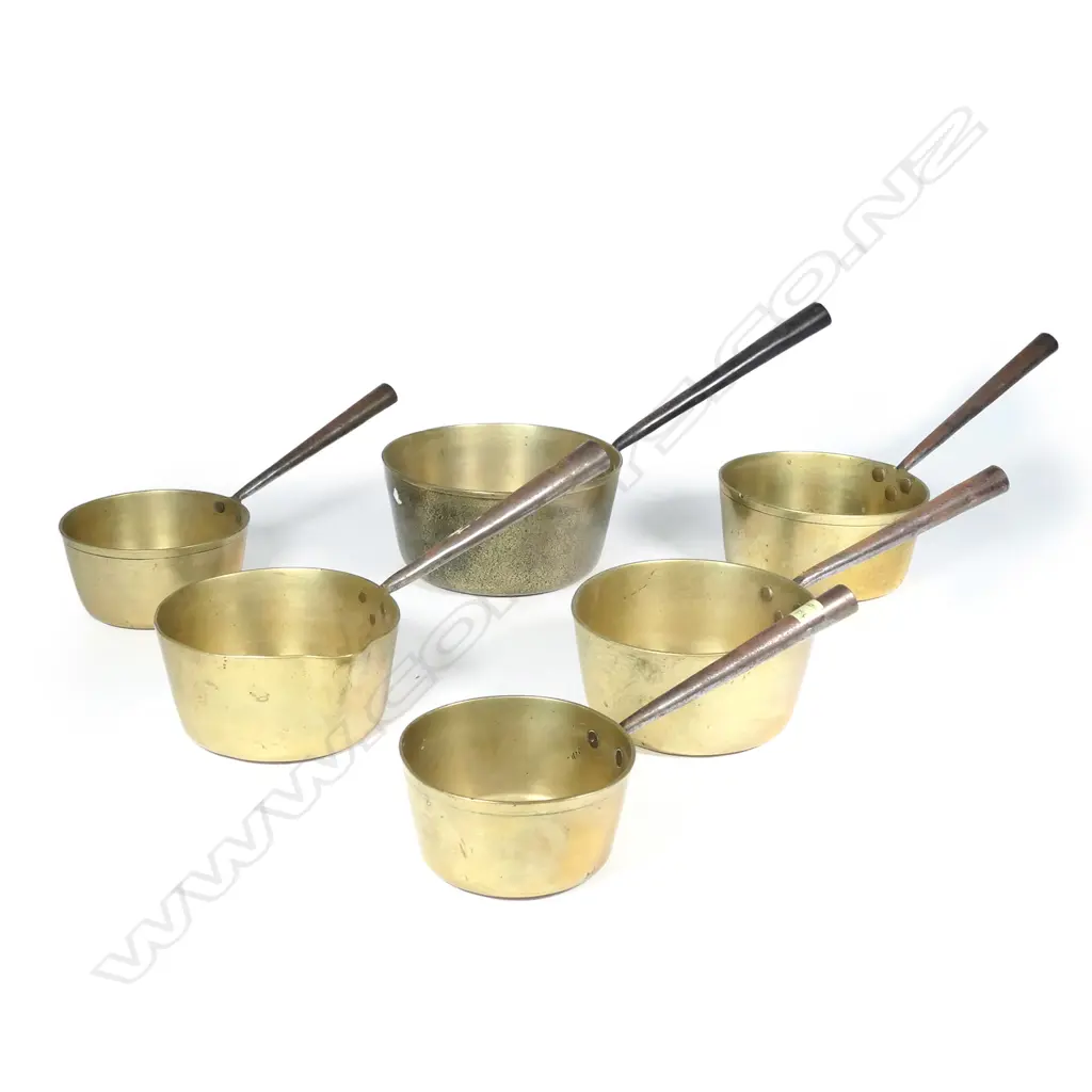 A graduated set of six Victorian brass cooking pots Image 1++