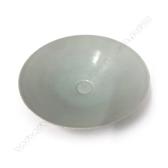 A fine Chinese porcelain celadon flared shallow bowl