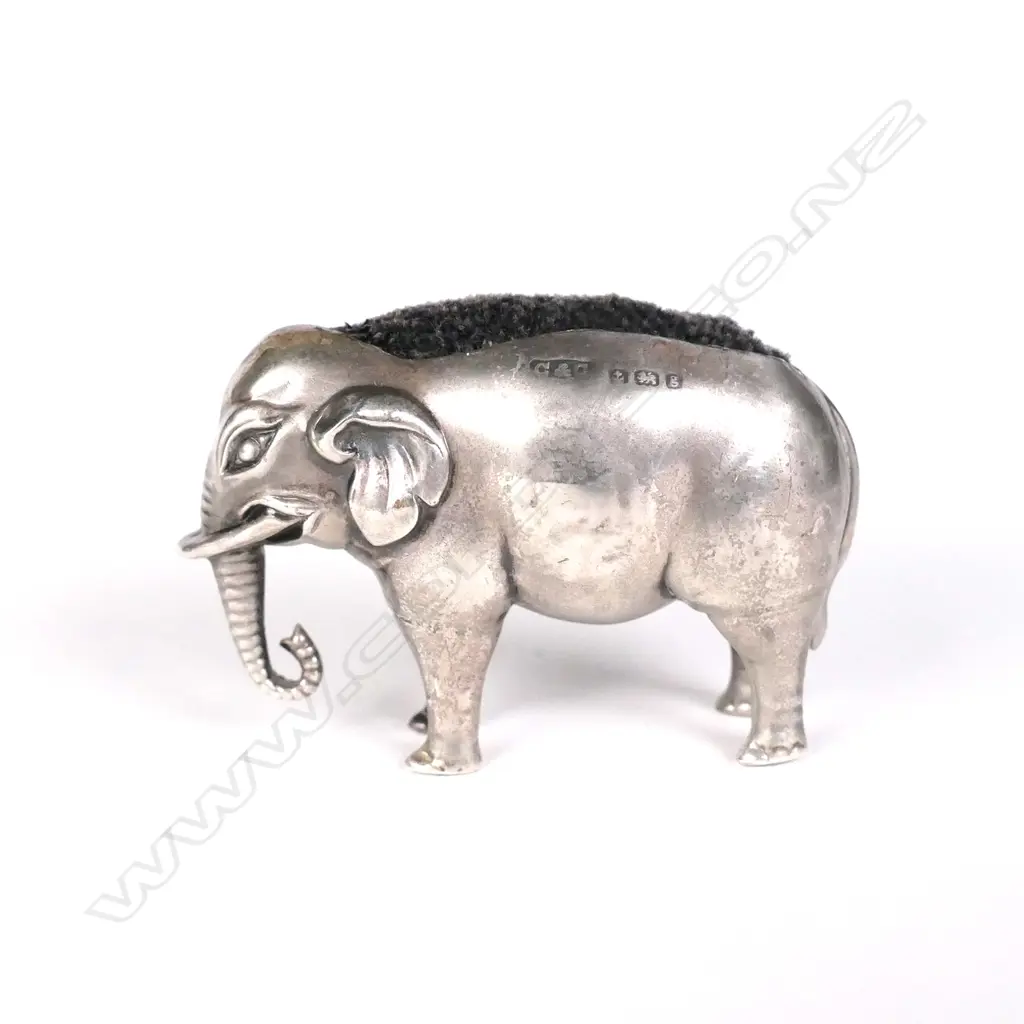 An Edwardian silver elephant pin cushion Image 1++