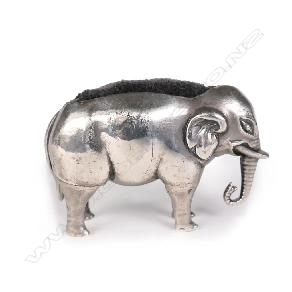 An Edwardian silver elephant pin cushion Image 1++