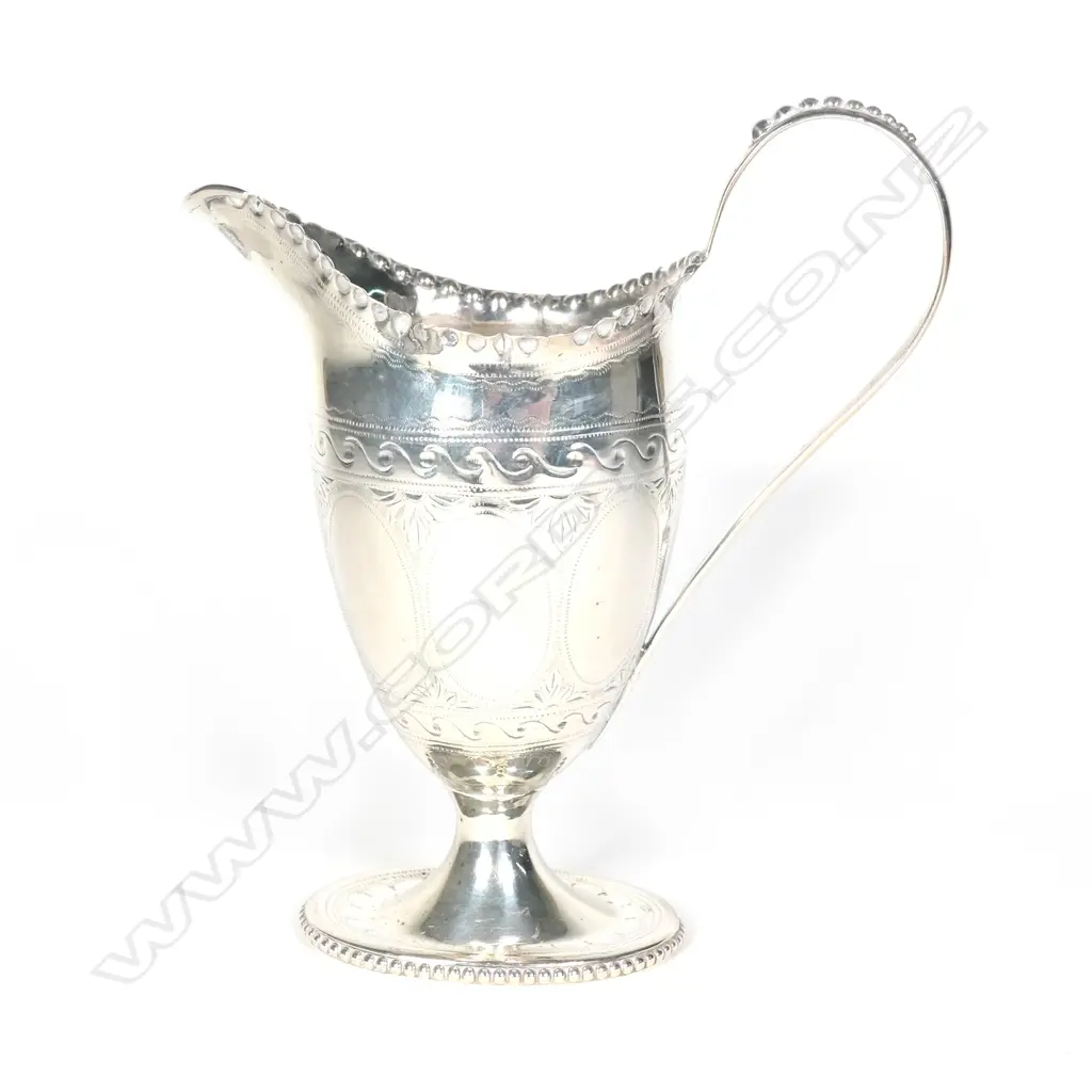 A Victorian silver helmet cream jug Image 1++