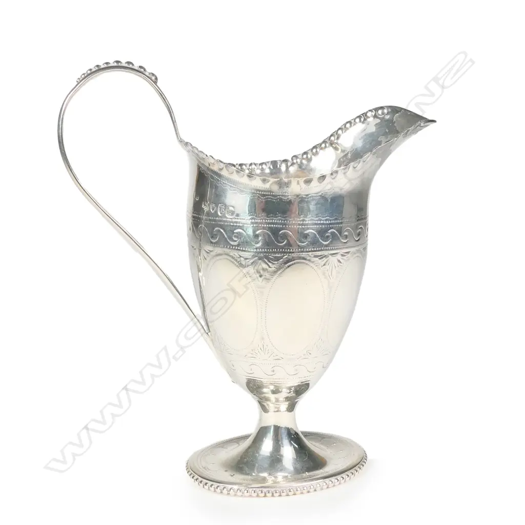 A Victorian silver helmet cream jug Image 1++