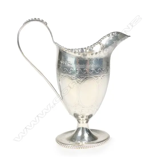 A Victorian silver helmet cream jug