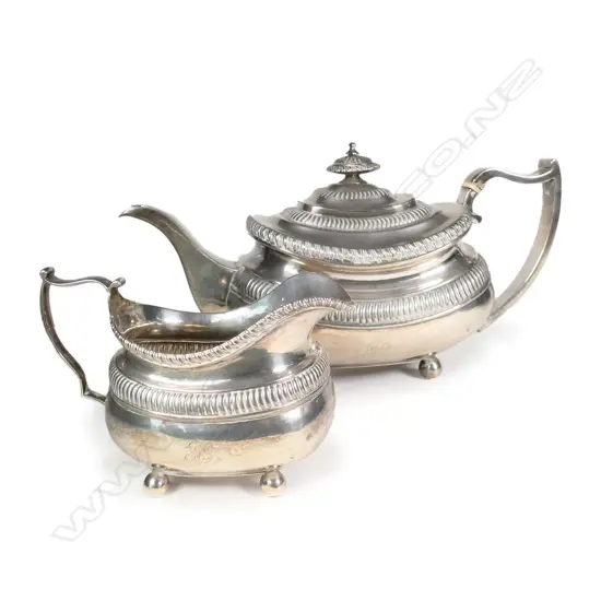 A George III silver teapot and milk jug