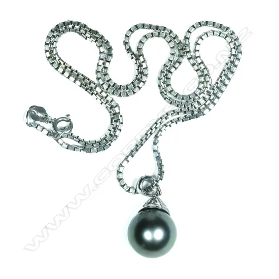 An 18ct white gold diamond and black pearl pendant