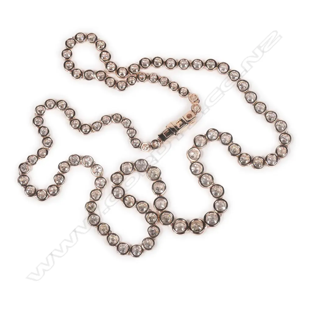 A 14ct rose gold diamond riviera necklace Image 1++