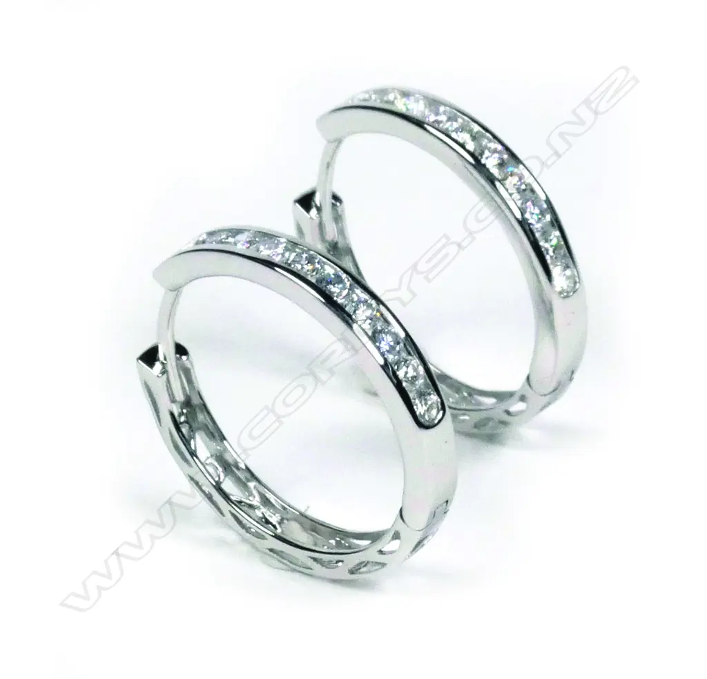 A pair of 14ct white gold diamond hoop earrings Image 1++