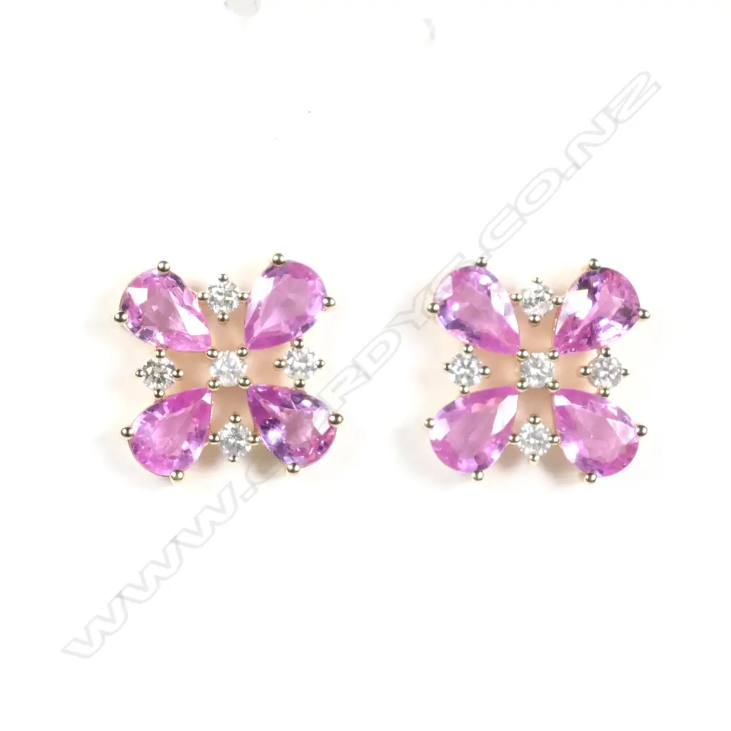 A pair of 14ct yellow gold sapphire and diamond stud earrings Image 1++